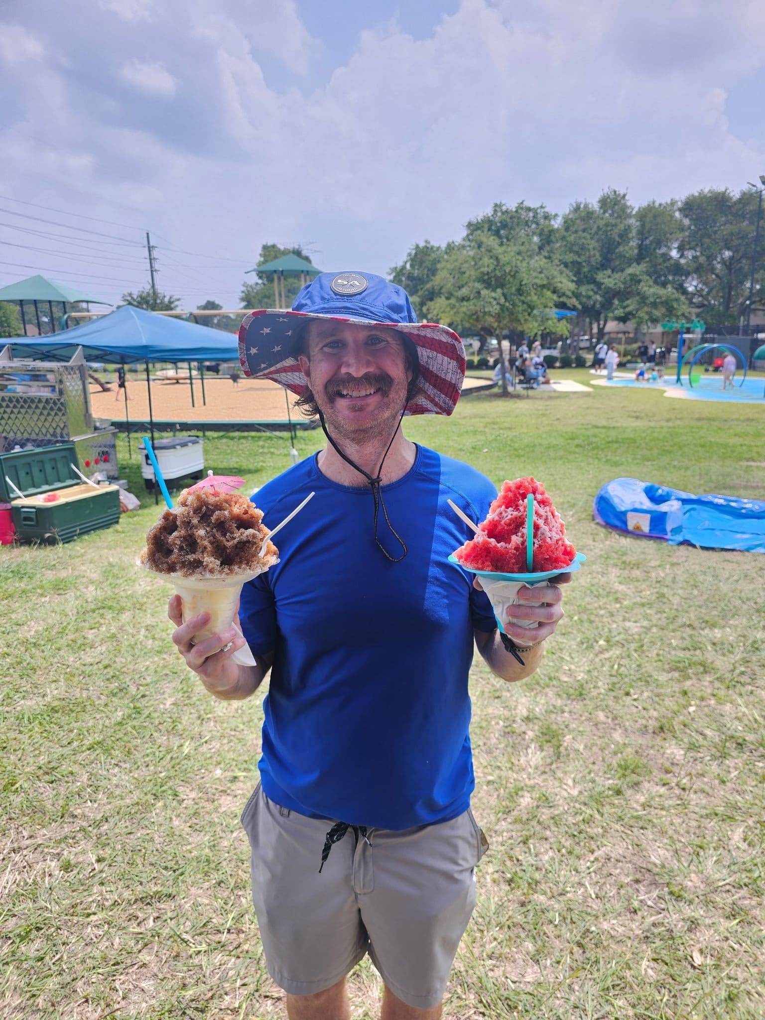 Dad two shaved ices park event — Frostbite Shaved Ice N'More