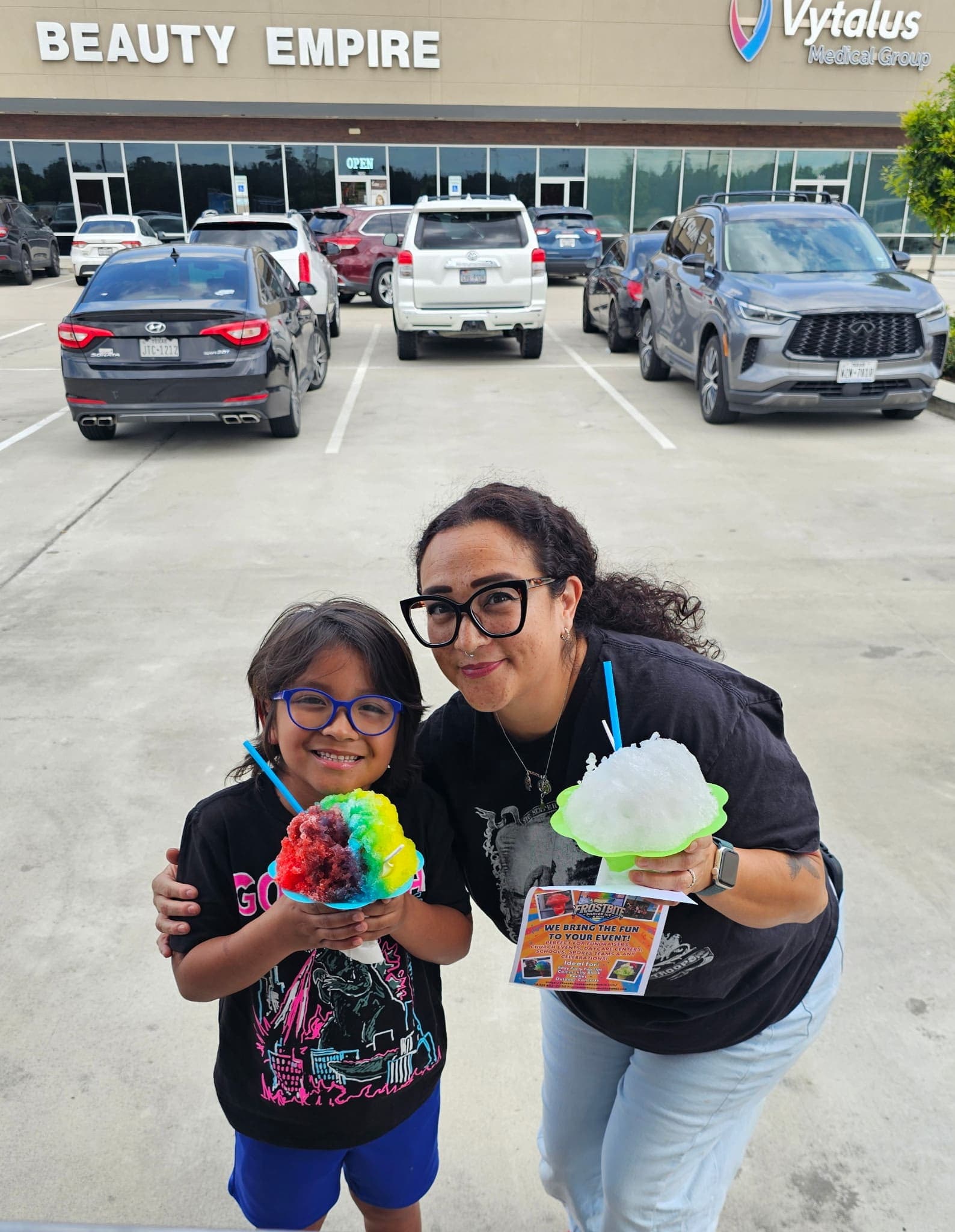 Mom and son rainbow shaved ice — Frostbite Shaved Ice N'More
