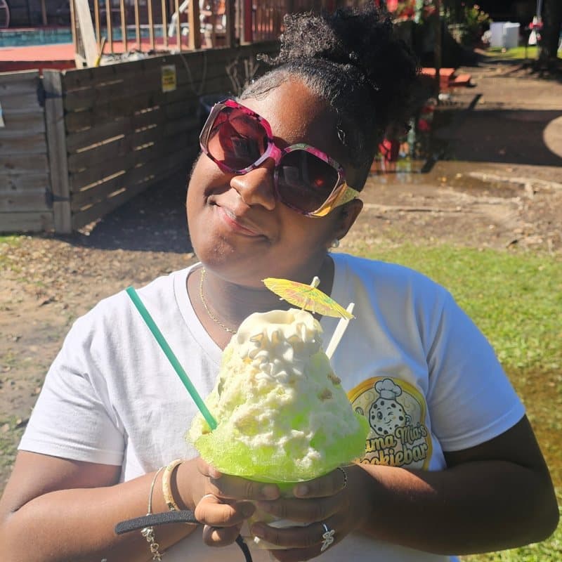 Athletes celebrating with Frostbite shaved ice at a sports event